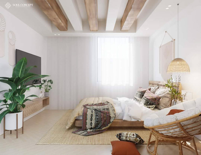Phòng ngủ với tivi và cây xanh nhỏ để điều hòa không khí